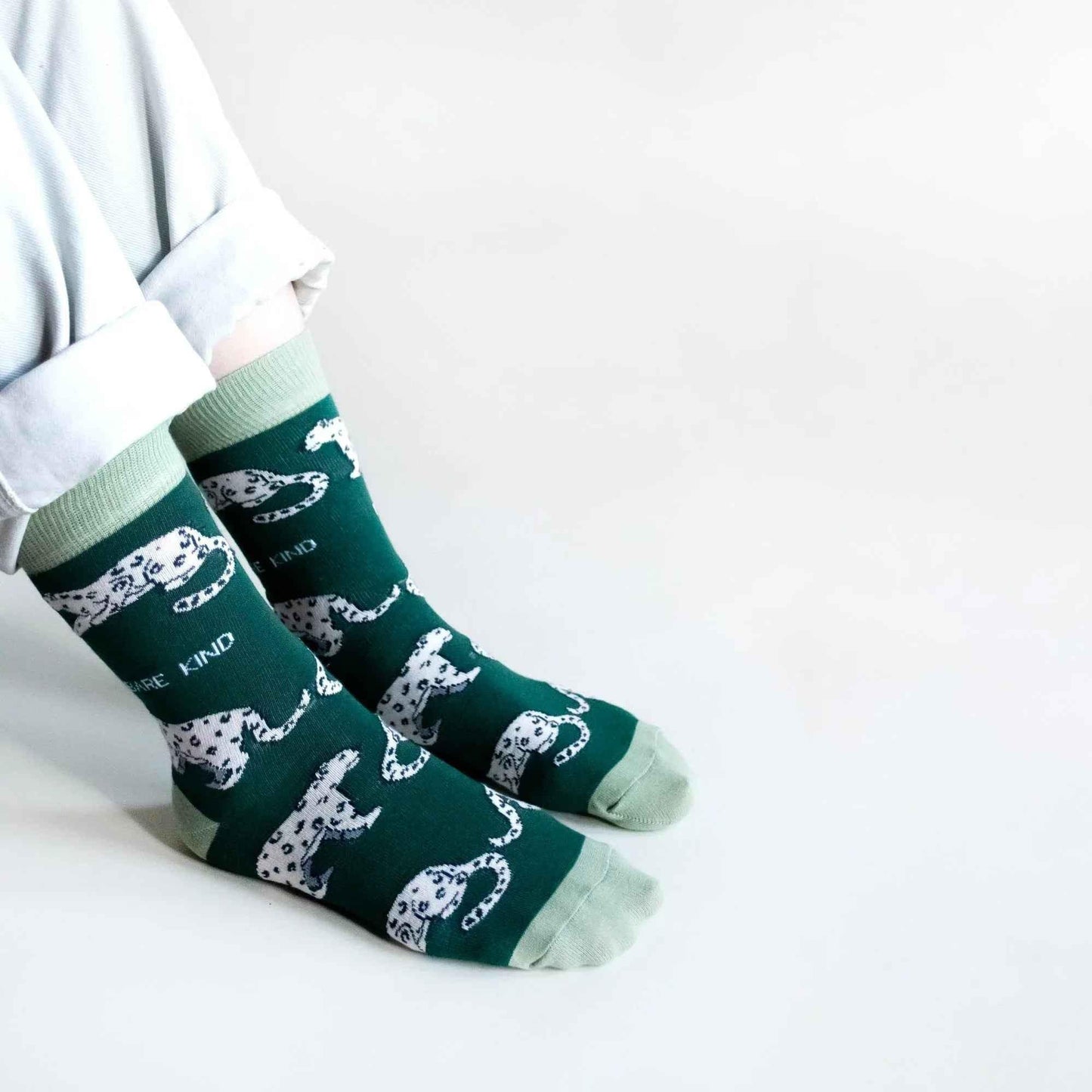 Barekind NZ bamboo socks featuring a snow leopard design, adult size 4-7, soft and eco-friendly socks for wildlife conservation.