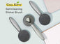 Self-cleaning Slicker Brush for pets by Cool Kitty Cat Litter, showing the brush's fine metal bristles and ergonomic handle.