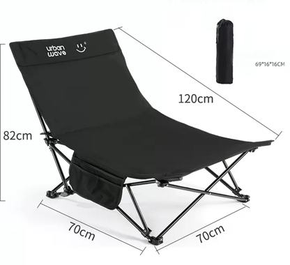Black ECOTREK portable folding beach chair with enhanced size and comfort, showing its frame and padded seat.