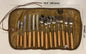 ECOTREK stainless steel flatware cutlery set for outdoor dining, 14-piece cookware set with forks, knives, and spoons on a table.