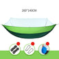 Light green ECOTREK portable mosquito hammock with quick-open design and built-in net for outdoor relaxation and insect protection.