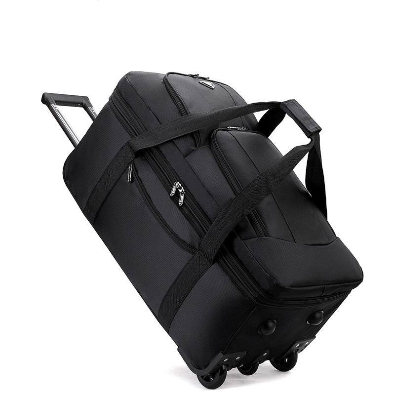 Black ECOTREK expandable rolling checked-in duffle bag with wheels, showing its spacious design and sturdy handle.