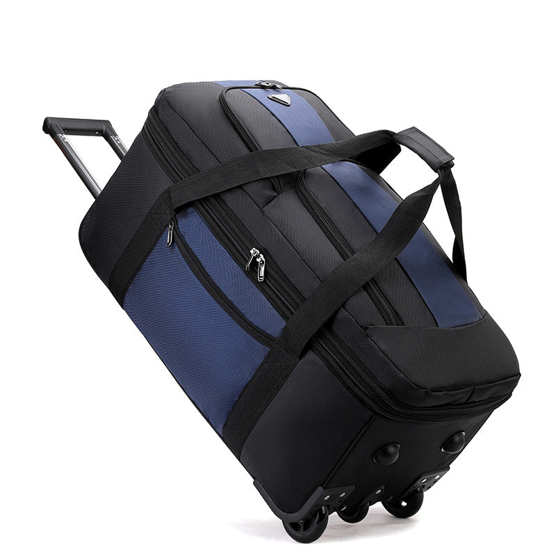 Black ECOTREK expandable rolling checked-in duffle bag with wheels, showcasing its spacious design and sturdy handles.