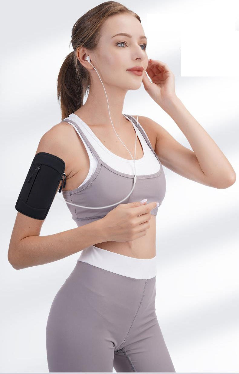 Pink waterproof ECOTREK running armband with two pockets for phones up to 6.8 inches, ideal for gym and outdoor exercise.