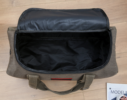 ECOTREK canvas storage bag with high capacity for travel, camping, and moving, shown filled with clothes and gear.