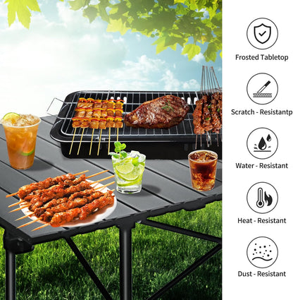 ECOTREK 120 cm portable folding camping table in black, ideal for outdoor cooking, picnics, and outdoor activities.