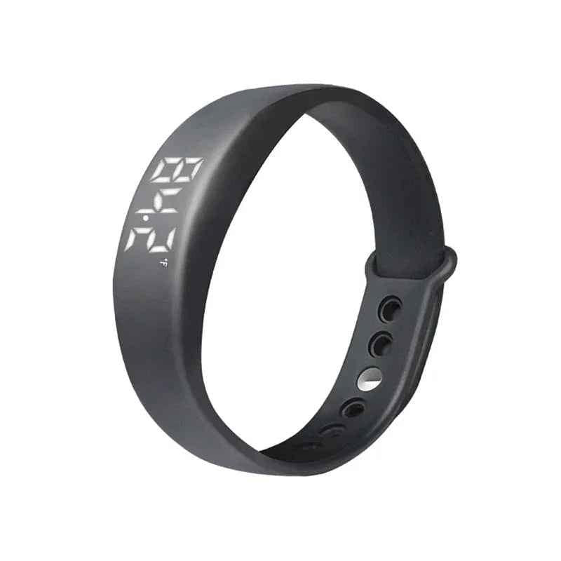 Blue Eldertech Vibratime vibrating alarm watch showing digital display with alert icons and adjustable strap.