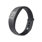 Blue Eldertech Vibratime vibrating alarm watch showing digital display with alert icons and adjustable strap.