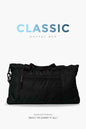 Black Fuaark NZ duffle bag with sturdy handles and spacious interior, perfect for stylish travel and weekend trips.