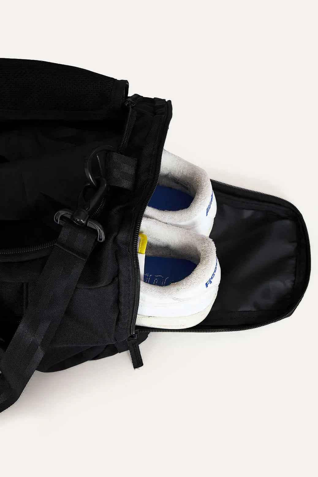 Black Fuaark Nz duffle bag with sturdy handles and spacious interior, perfect for stylish travel and weekend trips.
