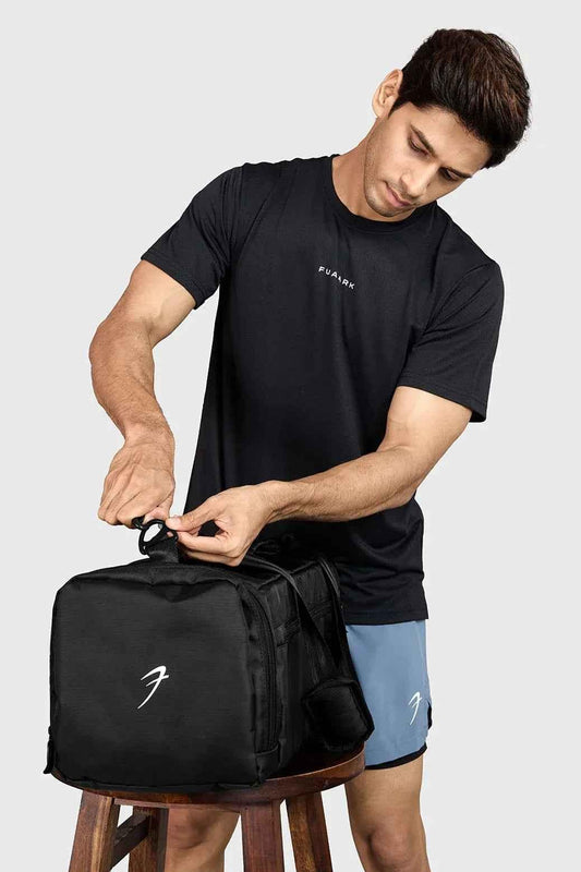 Black Fuaark Nz Elite Duffle Bag with sturdy handles and spacious main compartment for travel or gym use.