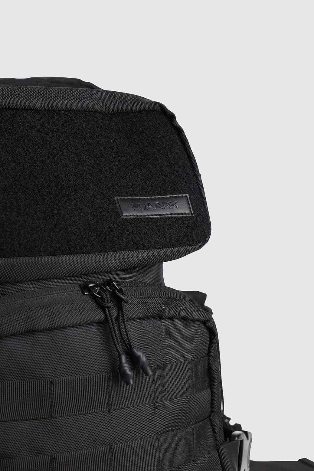 Black Ironclad Tactical Backpack by Fuaark Nz, featuring multiple compartments and durable straps, designed for outdoor and tactical use.