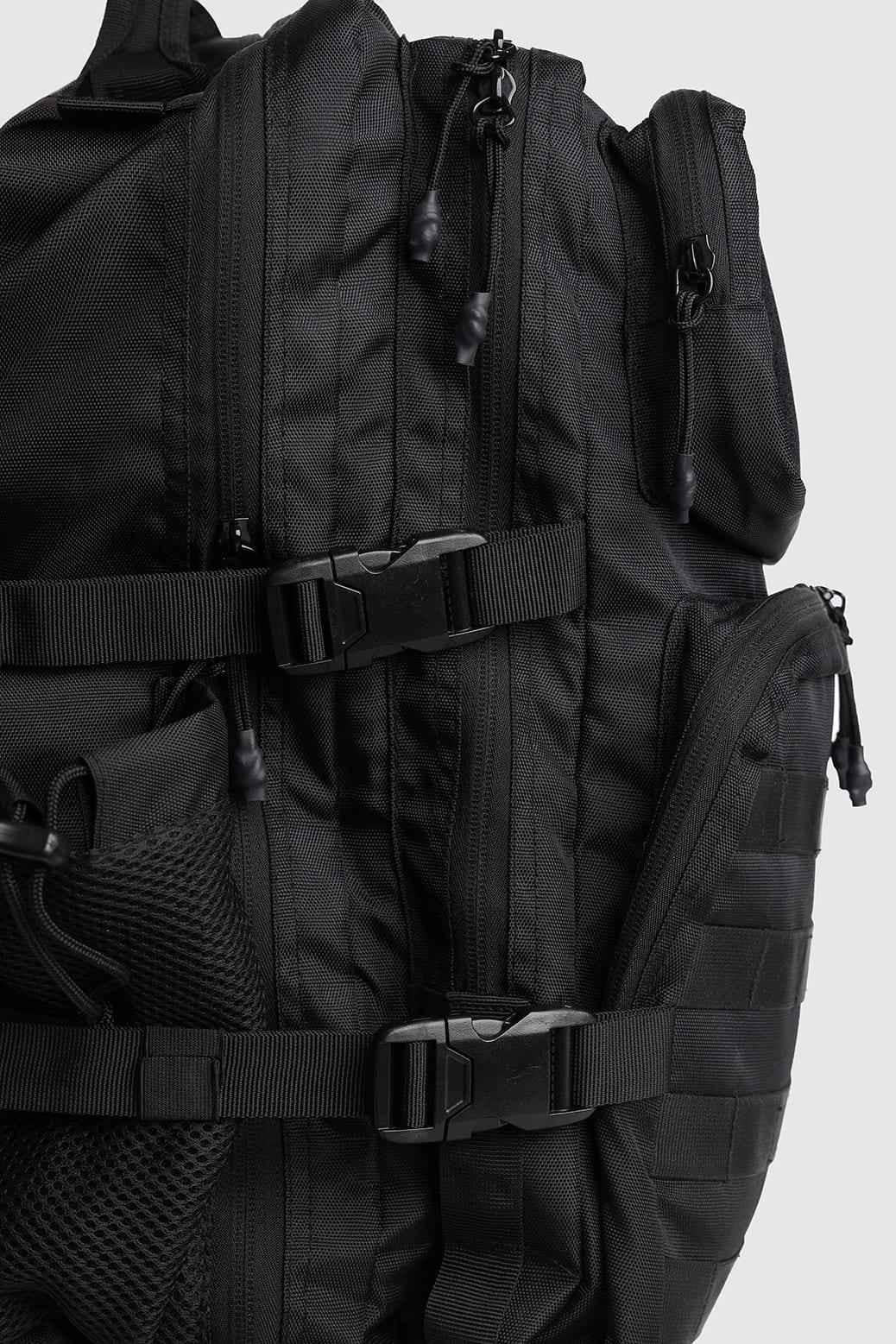 Black Ironclad Tactical Backpack by Fuaark Nz, a durable bag with multiple compartments and rugged design for outdoor use.