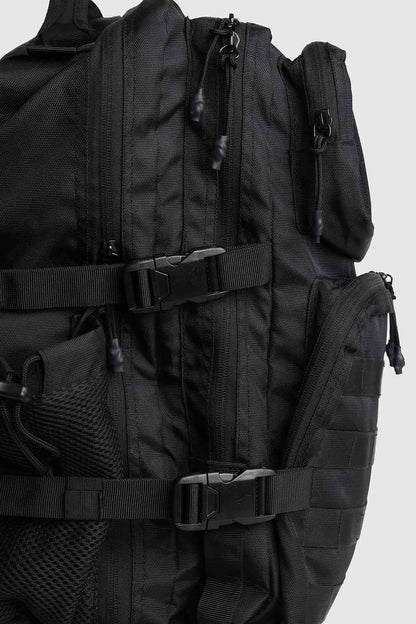 Black Ironclad Tactical Backpack by Fuaark Nz, a durable bag with multiple compartments and rugged design for outdoor use.