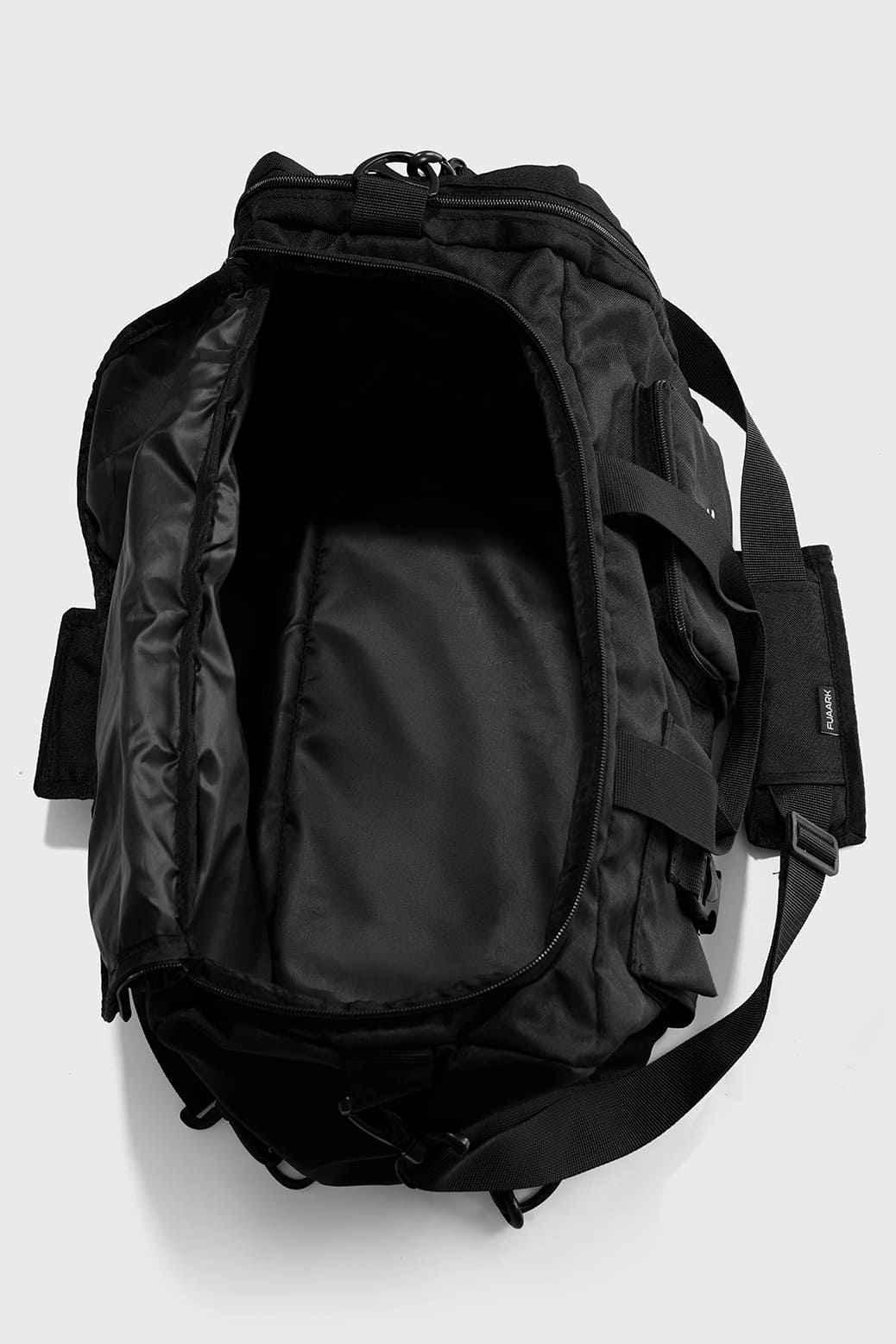 Black Fuaark Nz Peak Hybrid Bag, versatile and stylish backpack with multiple compartments and padded shoulder straps.