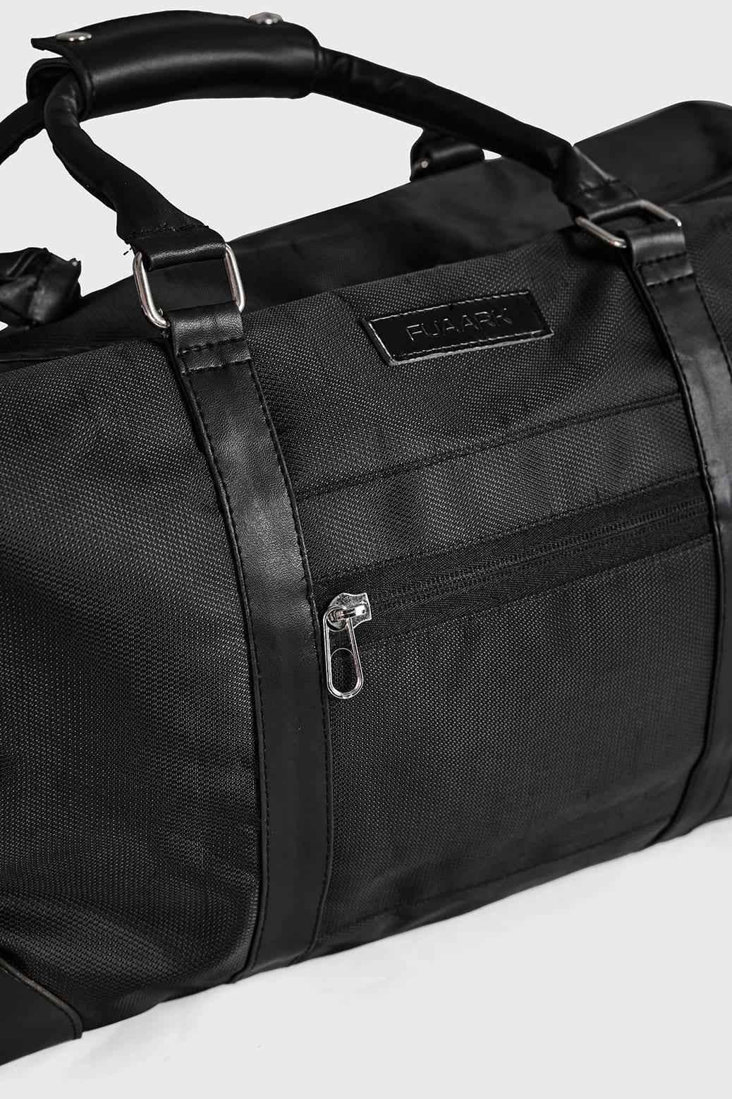 Black Vault Duffle Bag by Fuaark NZ, shown with sturdy handles and spacious interior for travel or gym use.