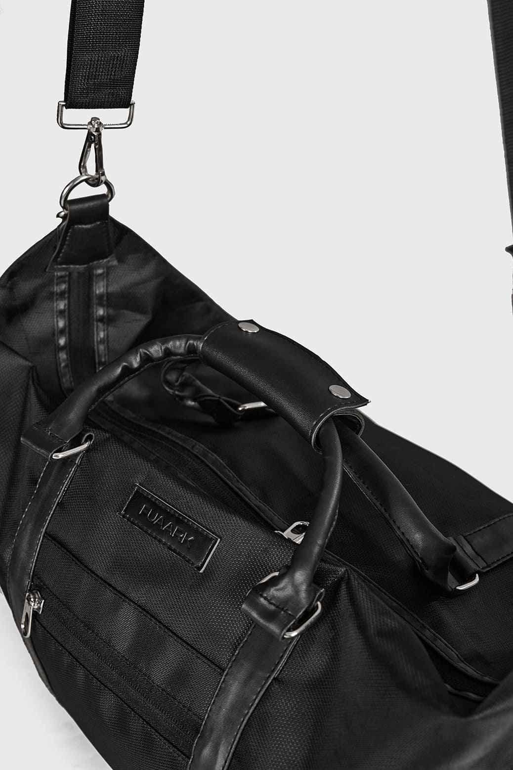 Black Vault Duffle Bag by Fuaark Nz, showing a spacious, stylish travel bag with sturdy handles and a sleek design.