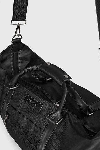 Black Vault Duffle Bag by Fuaark Nz, showing a spacious, stylish travel bag with sturdy handles and a sleek design.