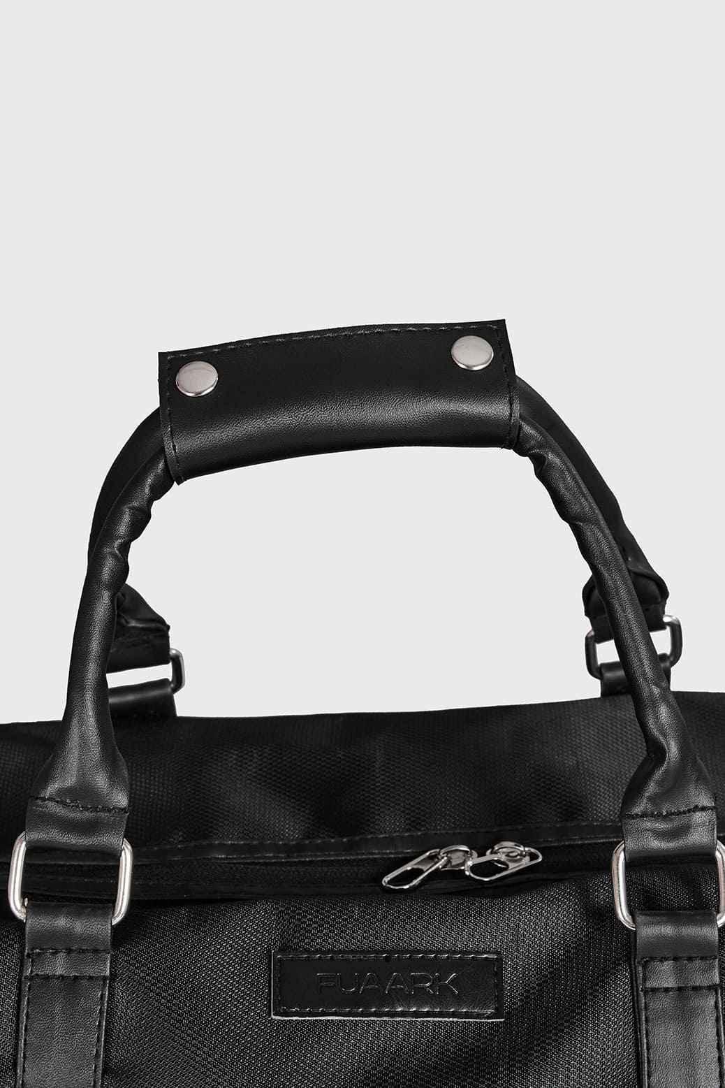 Black Vault Duffle Bag by Fuaark NZ, featuring sturdy handles and spacious interior for travel or gym use.