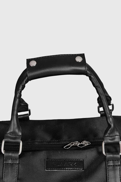 Black Vault Duffle Bag by Fuaark NZ, featuring sturdy handles and spacious interior for travel or gym use.