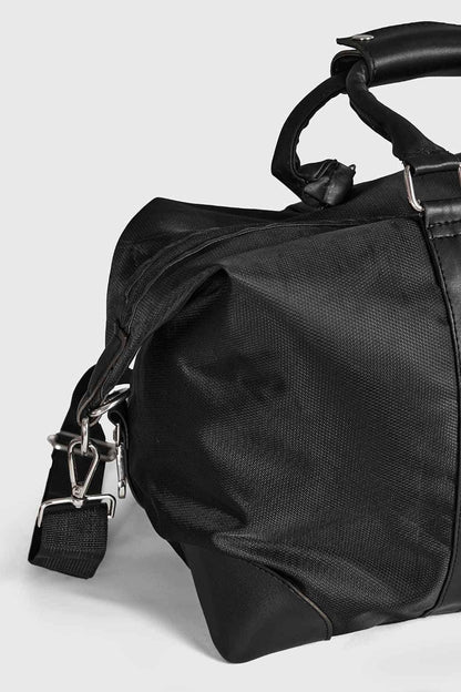 Black Vault Duffle Bag by Fuaark NZ featuring sturdy handles and spacious main compartment for travel or gym use.