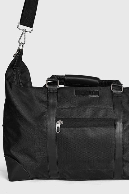 Fuaark Nz Vault Duffle Bag in black showing a spacious fabric bag with handles and a sleek, minimalist design.