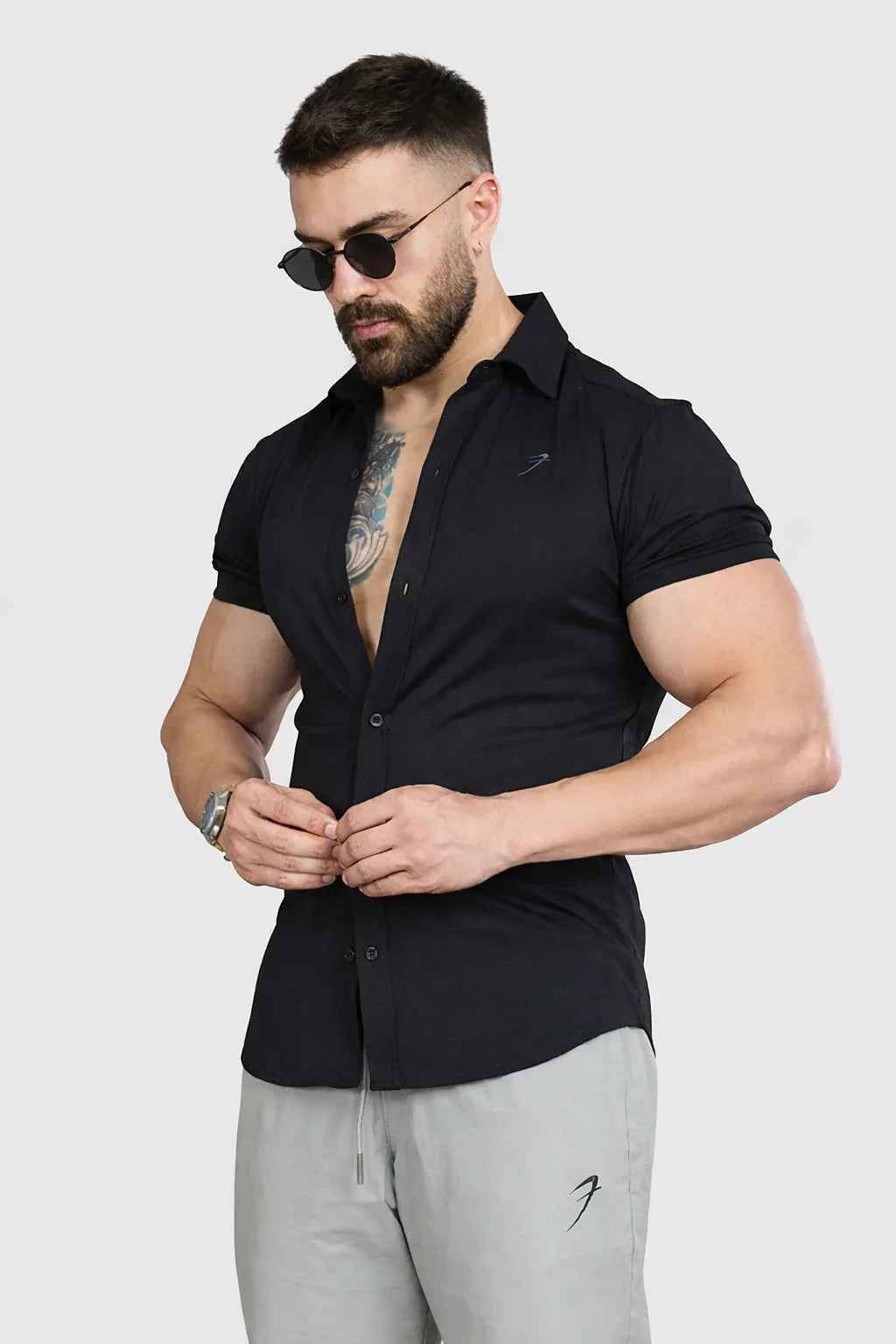 Black Aero Casual Shirt by Fuaark Nz, shown laid flat with long sleeves and collar, made from lightweight fabric.