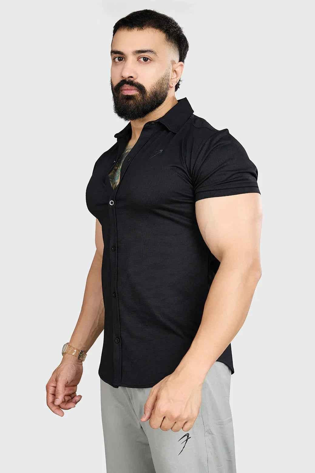 Black Aero casual shirt by Fuaark Nz with a relaxed fit and button-front design, shown on a model.