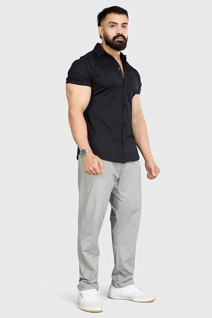 Black Aero casual shirt by Fuaark Nz, featuring a comfortable fit and stylish design, displayed on a hanger.