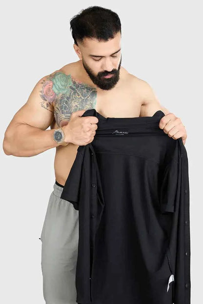 Black Fuaark Nz Aero casual shirt laid flat, showing front design and collar detail.