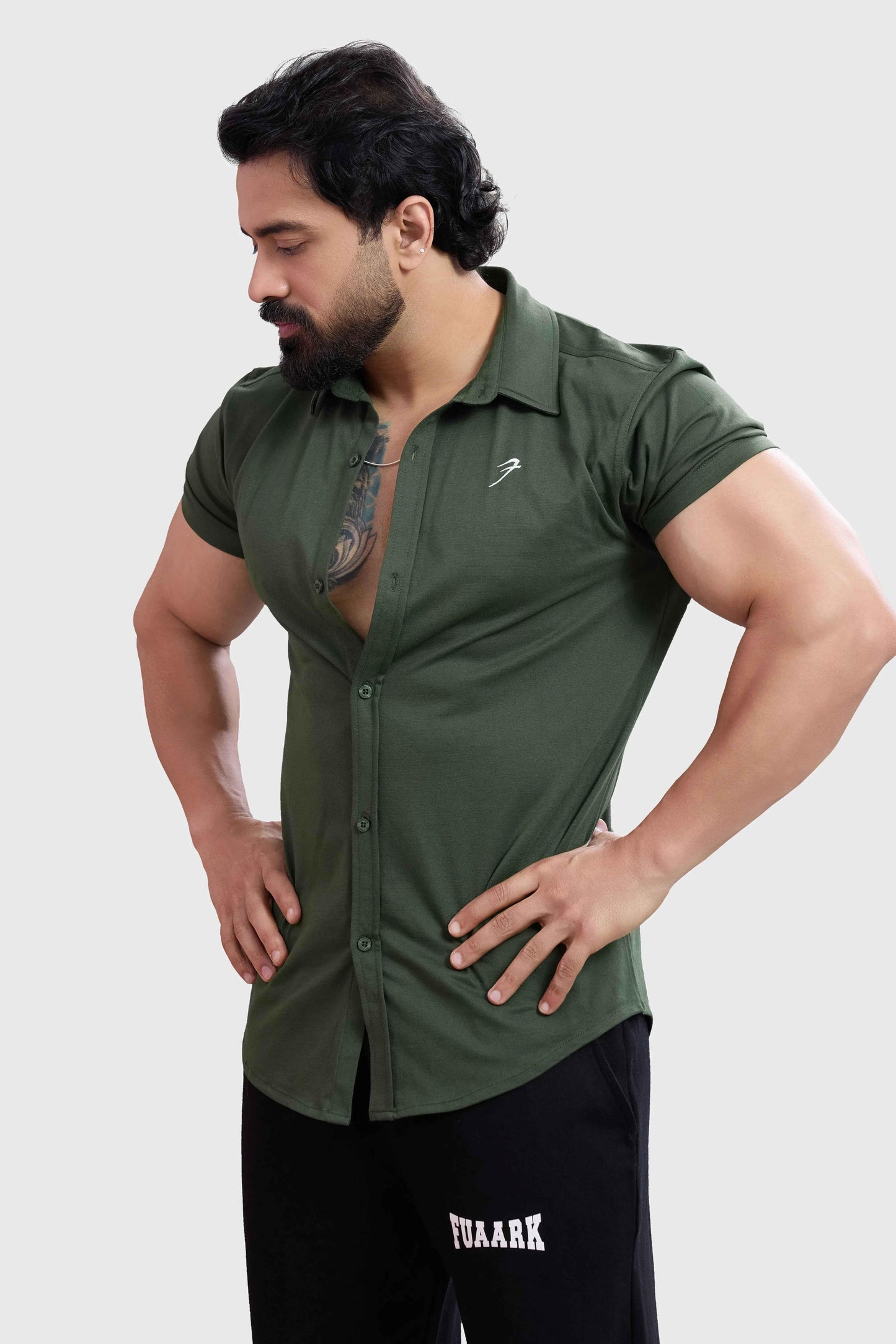 Olive green Aero casual shirt by Fuaark Nz, featuring a relaxed fit and soft fabric, displayed on a hanger.