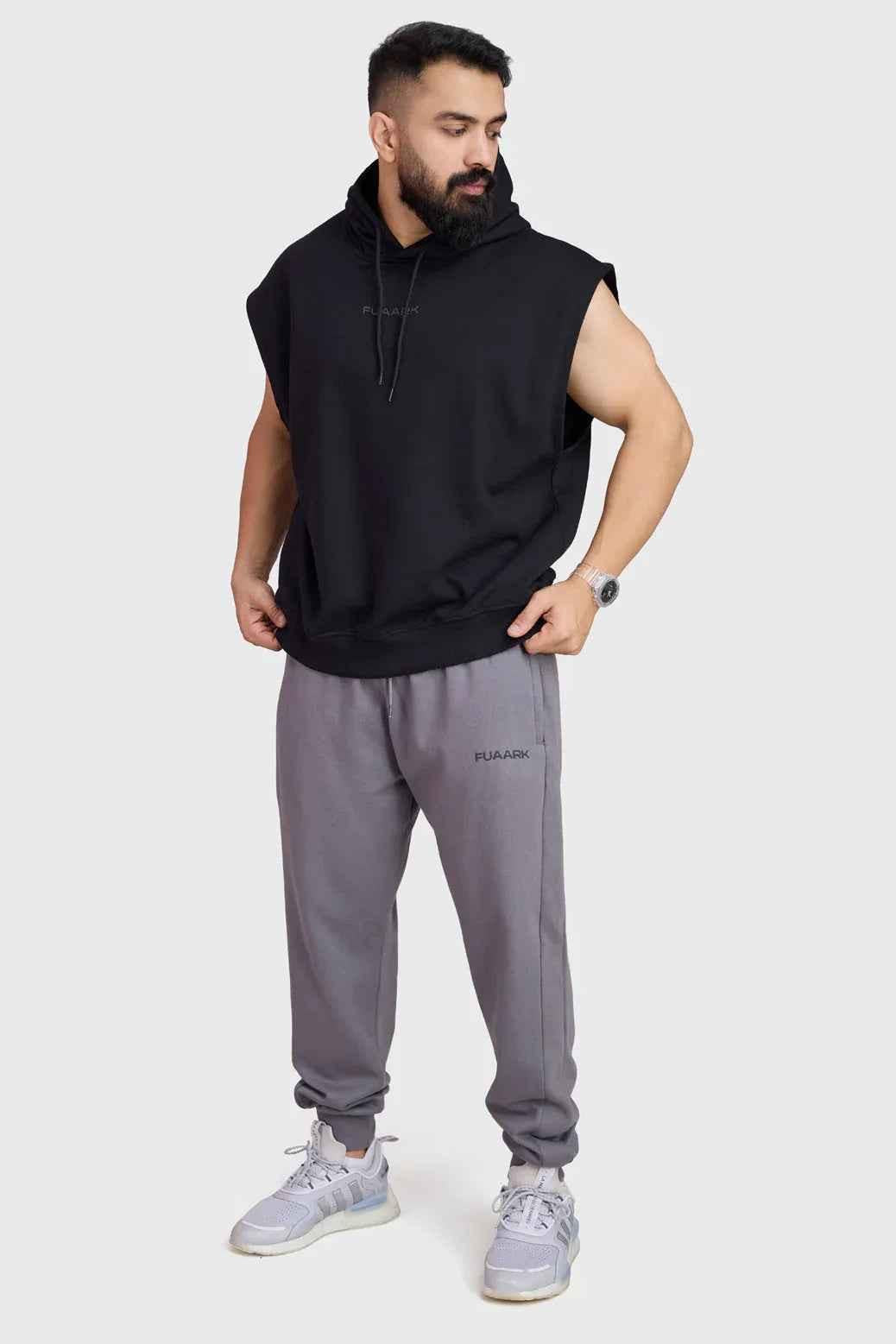 Black Fuaark Nz Signature Cap Sleeves Hoodie displayed on a model, featuring a casual fit and distinctive cap sleeves.