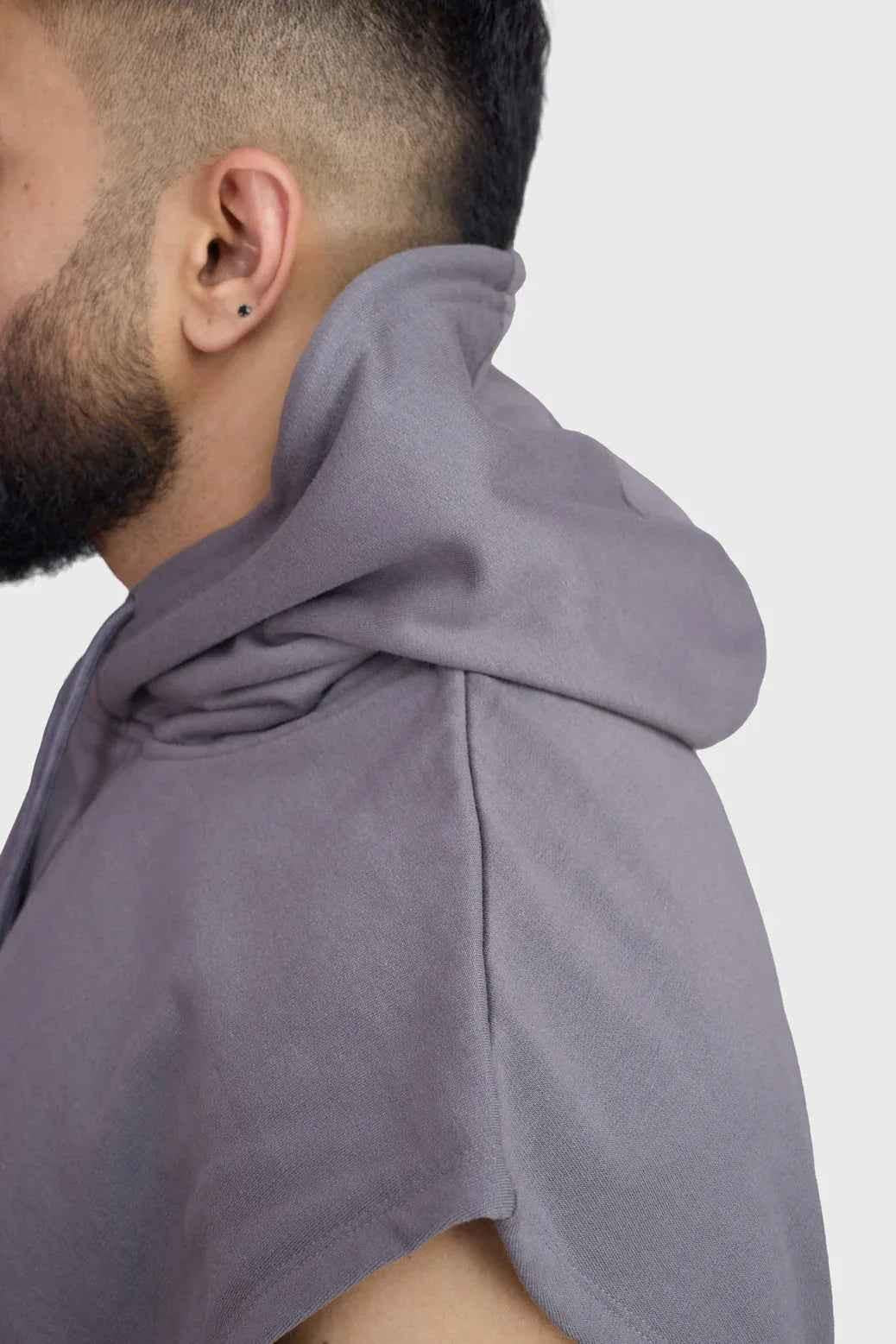 Fuaark Nz Signature dark grey cap sleeves hoodie with a relaxed fit and soft fabric, shown on a model.