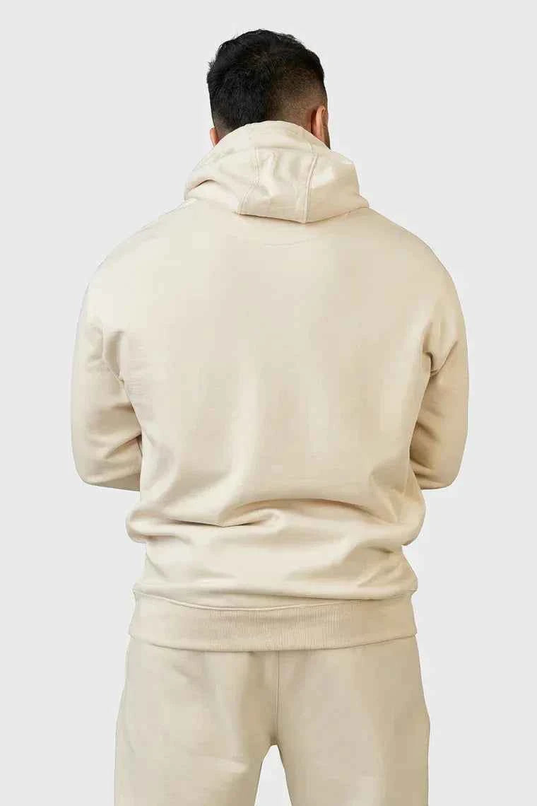 Unisex oversized beige hoodie by Fuaark Nz, stylish and comfortable with a relaxed fit, perfect for casual wear.