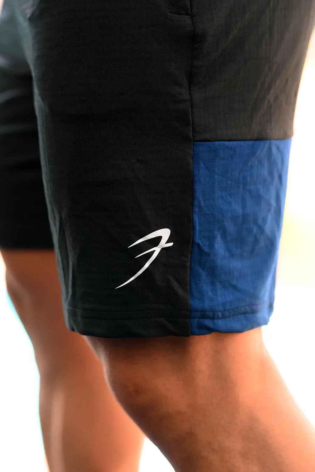 Black and blue Fuaark Nz jogger shorts with a relaxed fit, designed for comfort and casual style.