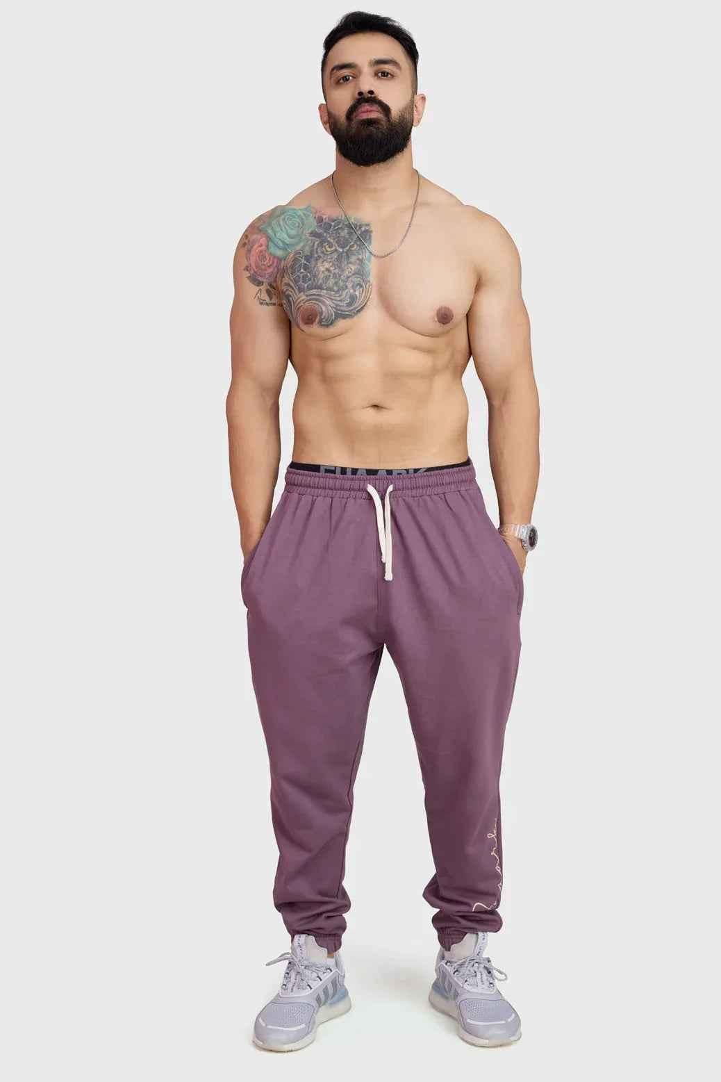 Fuaark Nz mauve oversized joggers laid flat, showcasing their stylish design and relaxed fit for ultimate comfort.