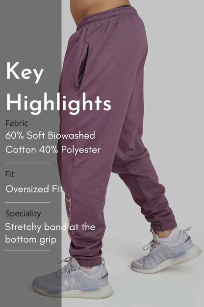 Fuaark Nz mauve oversized joggers laid flat, showcasing their relaxed fit and stylish design for ultimate comfort.