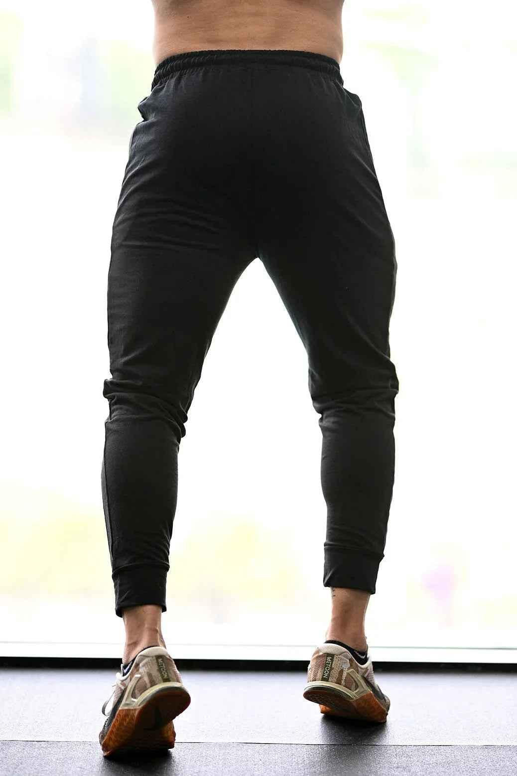 Black Fuaark Nz fall joggers for comfort, featuring a relaxed fit and sporty style, perfect for activewear and casual wear.