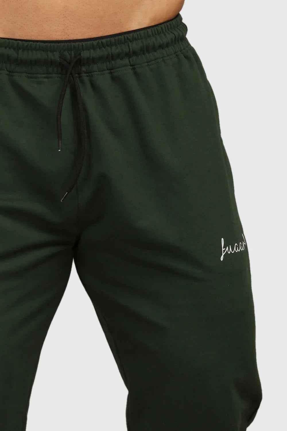 Green fall joggers by Fuaark Nz featuring a comfortable regular fit, perfect for autumn casual wear.
