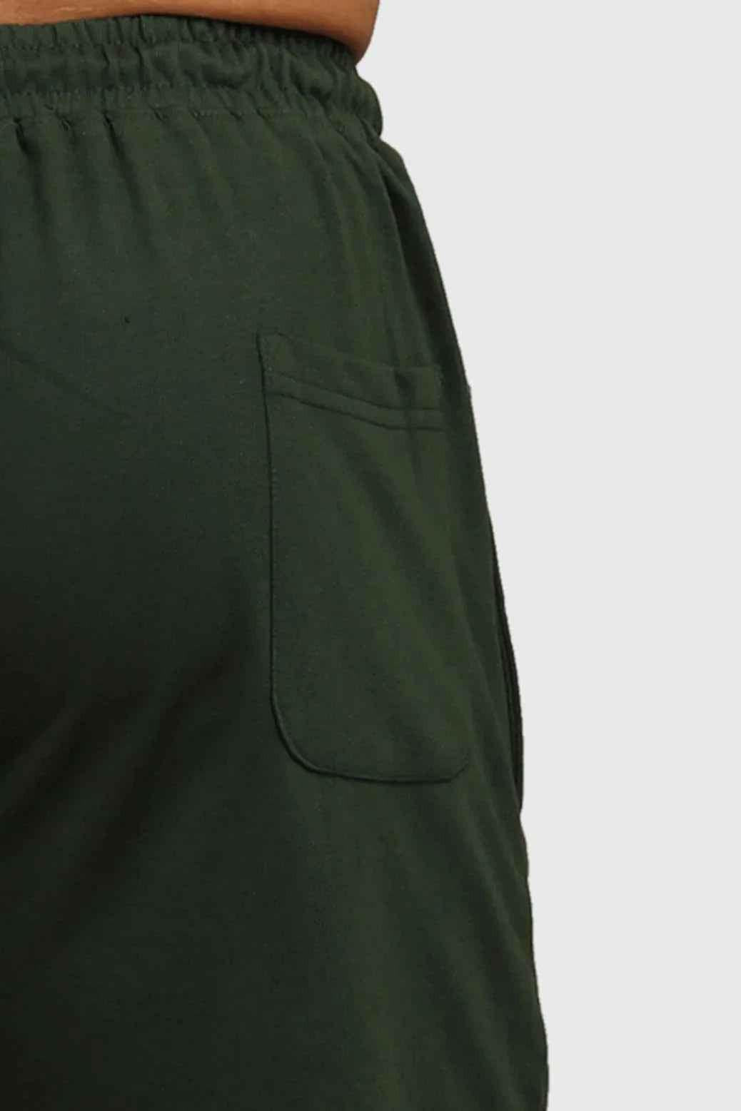 Green fall joggers by Fuaark NZ, comfortable regular fit, suitable for autumn casual wear, shown on a model.
