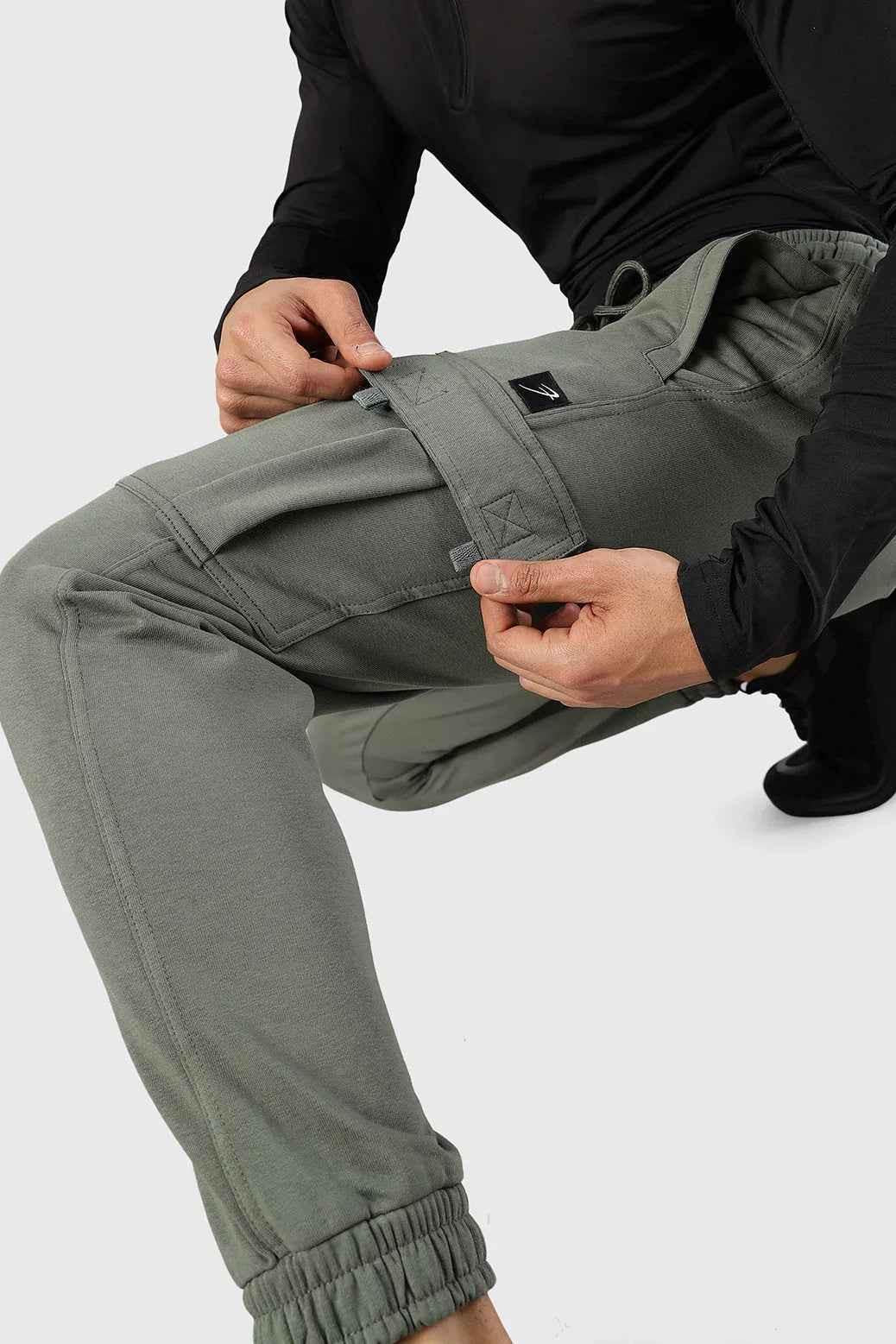 Olive green Fuaark NZ Flex Joggers shown on a model, featuring a relaxed fit and comfortable elastic waistband.