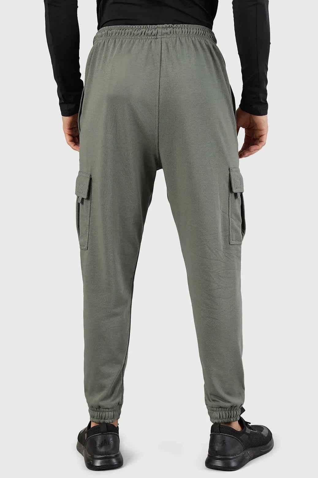 Olive green Flex Joggers by Fuaark Nz featuring a relaxed fit and elastic waistband, shown on a model.