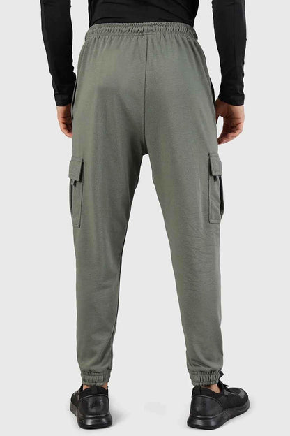 Olive green Flex Joggers by Fuaark Nz featuring a relaxed fit and elastic waistband, shown on a model.
