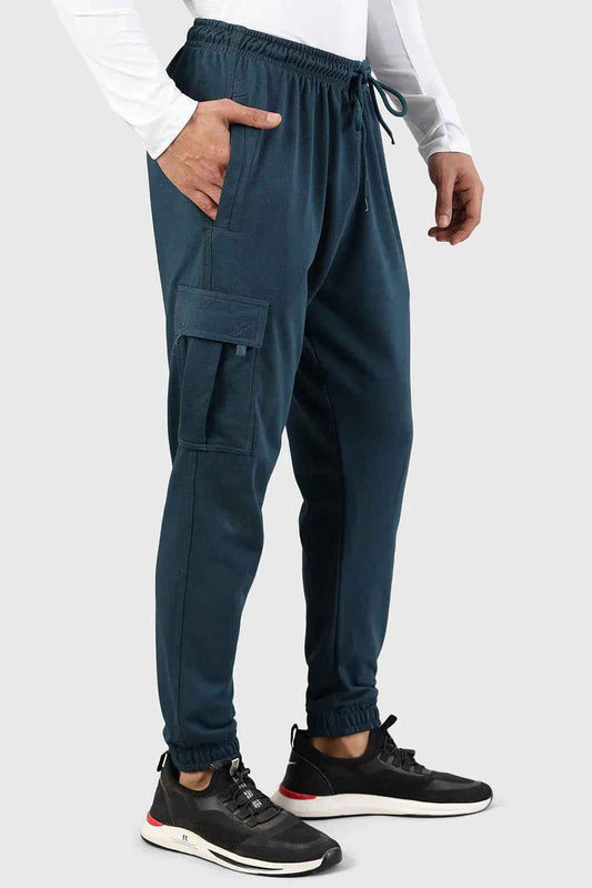 Fuaark Nz Flex Joggers in teal color, showing the comfortable fit and casual style, with elastic waistband and tapered legs.