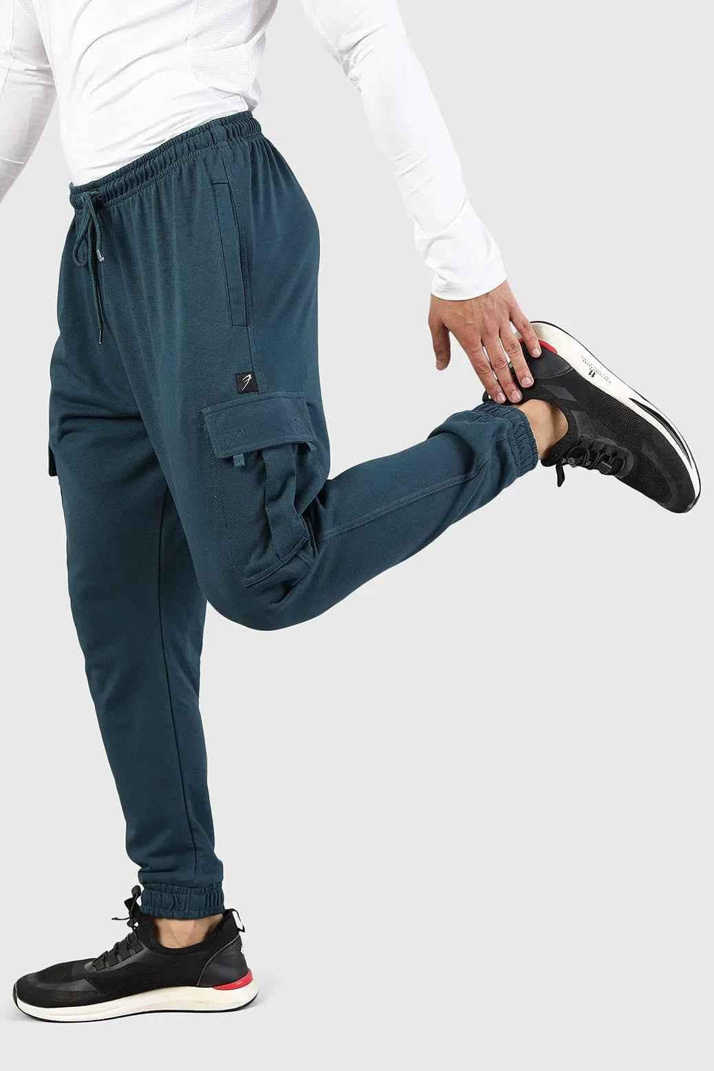 Teal Fuaark Nz Flex Joggers laid flat, showing their comfortable fit and stylish design with elastic waistband and tapered legs.