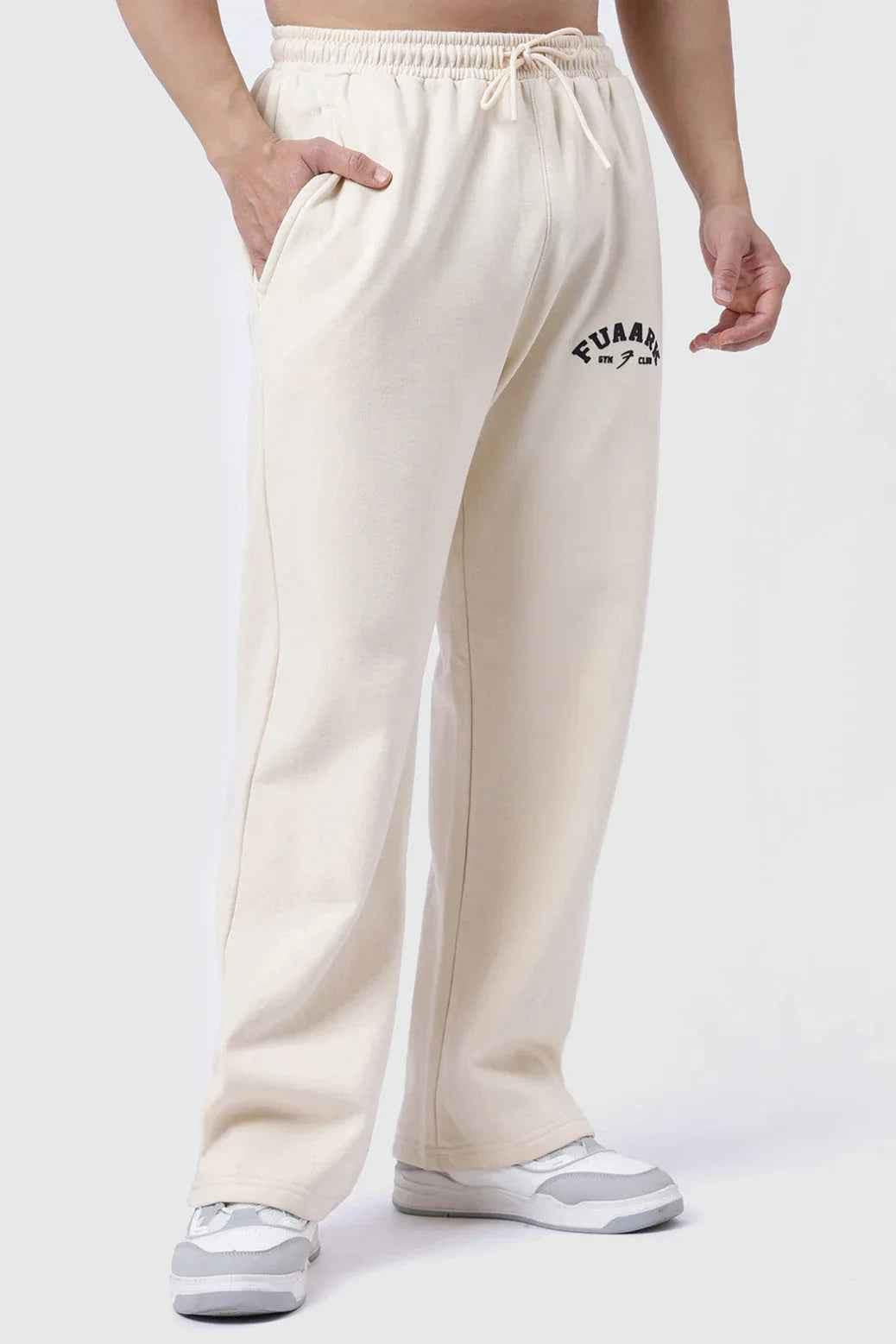 Beige Fuaark Nz laidback relaxed joggers pants, comfortable casual fit with elastic waistband and tapered leg design.