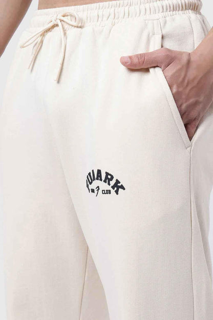 Beige Fuaark Nz laidback relaxed joggers pants with comfortable fit and casual style, shown on a model.