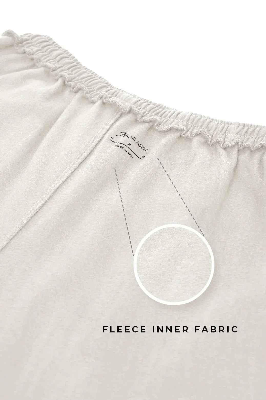 Beige laidback relaxed joggers by Fuaark NZ with a comfortable fit and casual style, shown on a model.