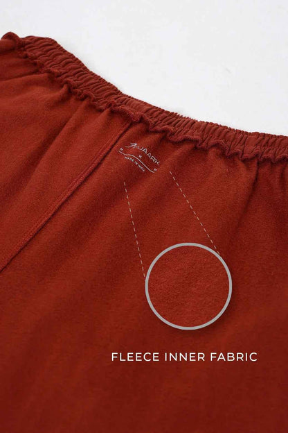 Fuaark Nz laidback relaxed joggers in rust color, made of soft fabric with a comfortable fit and casual style.