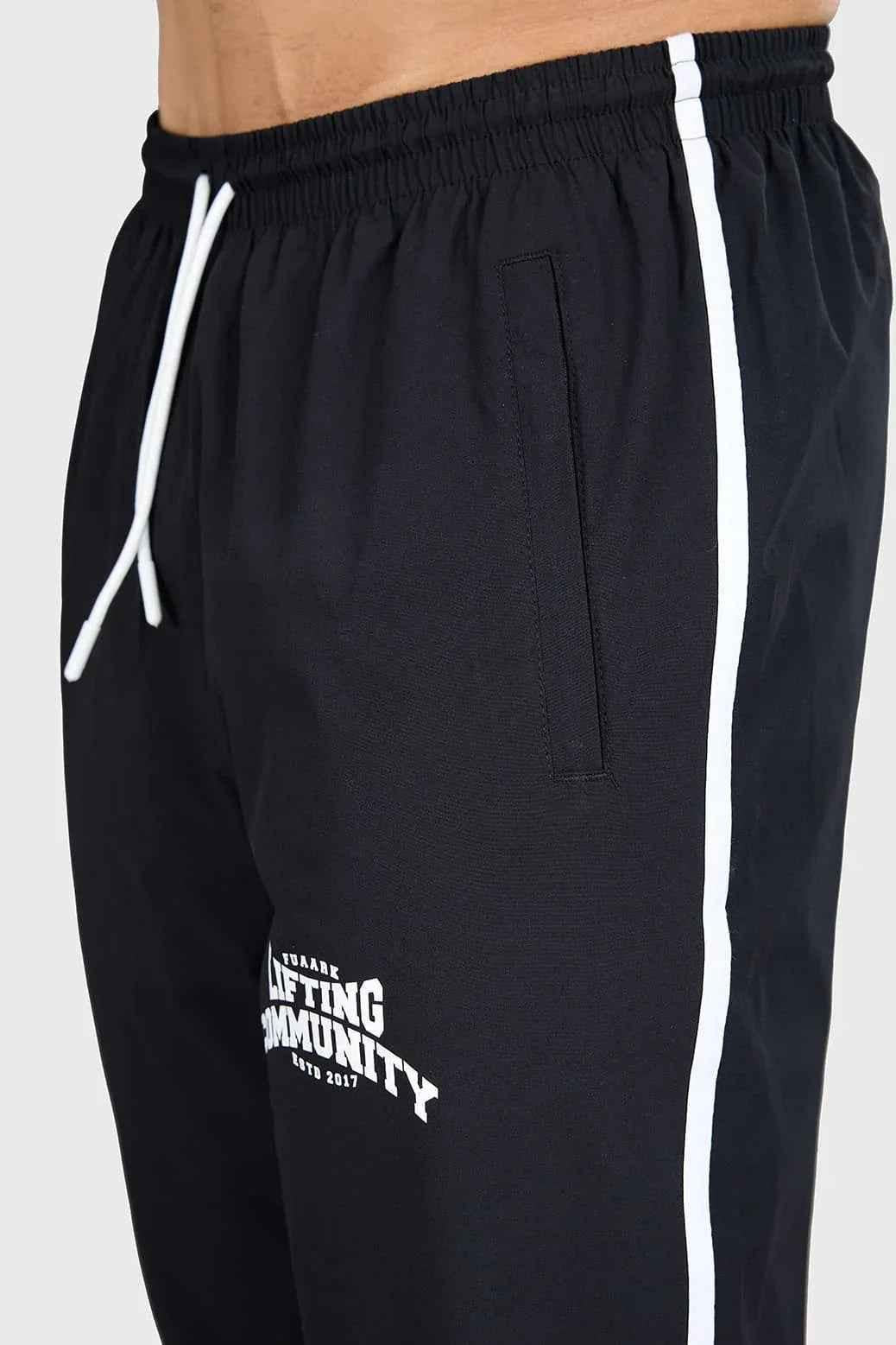Fuaark Nz black lifting joggers for men, designed for comfortable community workouts, featuring a relaxed fit and athletic style.